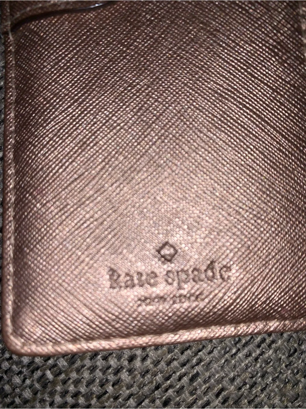 Kate Spade rose gold wallet with callouts